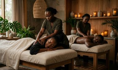 A couple receives massages side by side in a softly lit Nairobi spa.